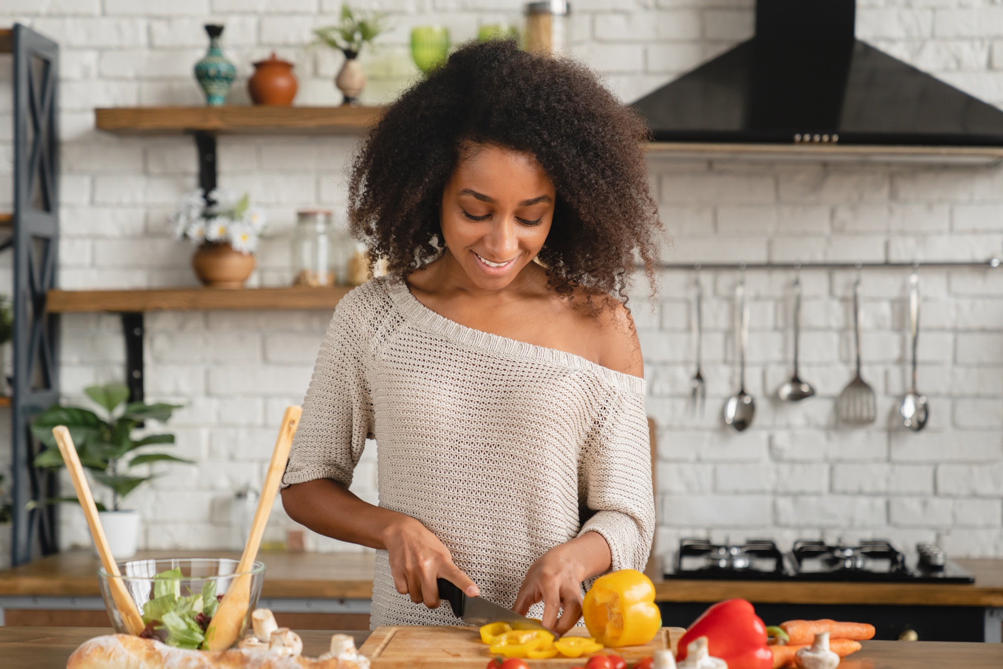 Girl cooking breakfast, making vegetable vegan salad for slimming, dieting, healthy eating habits